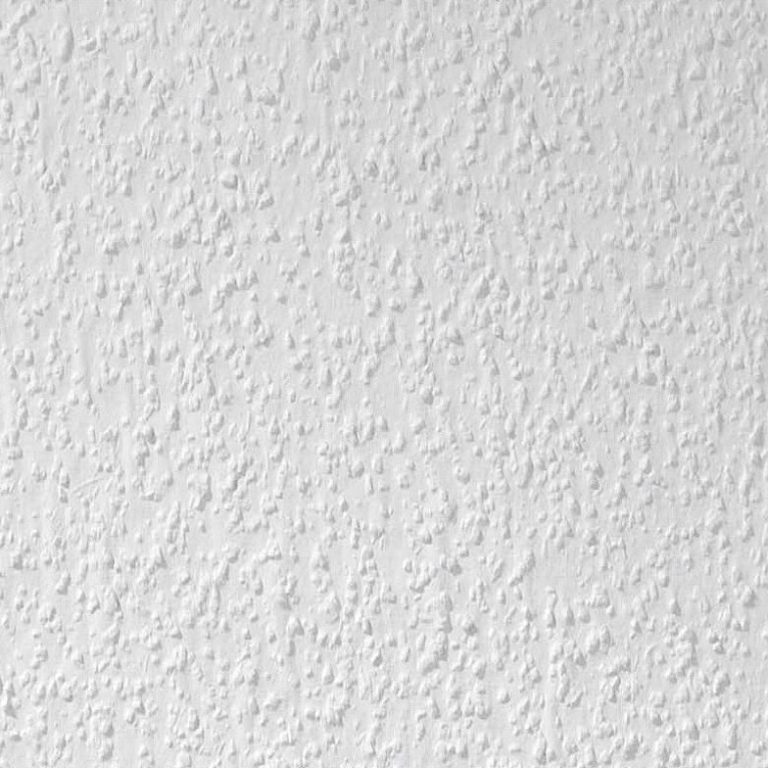 Texturierte, weiße Wandoberfläche mit feinen Unebenheiten.